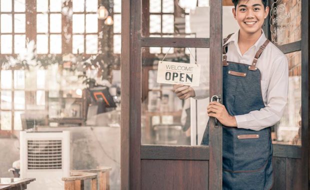 Small business owner at door