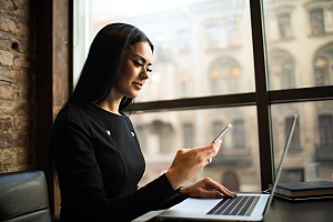 government contractor working at her desk and keeping up to date with federal regulations