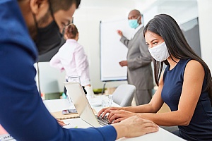 business professionals working in the office during coronavirus