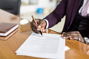 a certified public accountant signing a government contract negotiation