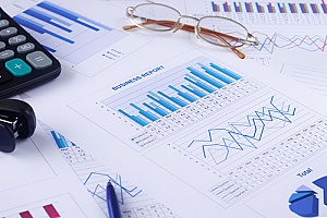 documents and graphs that represent financial reporting services