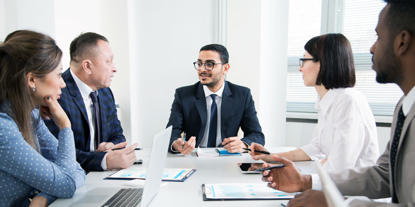 a tax reparation meeting between a business owner and an outsourced accounting firm