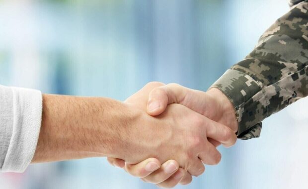 government contract accounting- man shaking hand with military officer