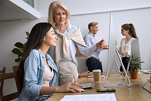 a business executive teaching a future leader who was identified through succession planning