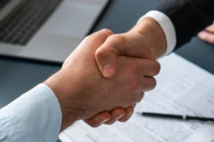 people shaking hands after contract