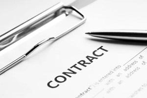 contract on clipboard with pen