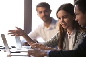 employee discussion on laptop