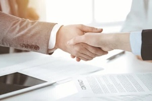 people shaking hands after contract