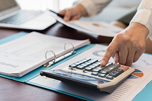 professional cpa working at a desk with paperwork 