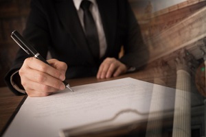 lawyer signing legal document and agreement with court