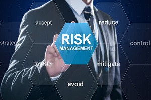 businessman pointing at risk management concept on digital screen