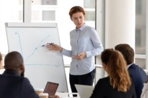 female cpa giving a presentation to other financial teams