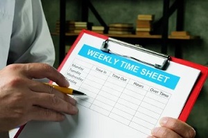 man showing weekly time sheet