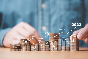 businessman stacking money coins with up arrow and percentage symbol for financial banking increase interest rate