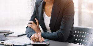 woman working on laptop and accounting financial report
