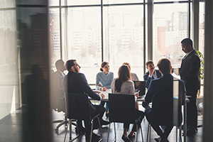 Team in a meeting in conference room.