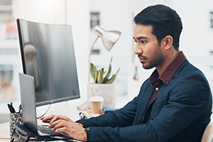 Man working on his laptop at his desk