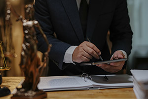 Government contractor on tablet at desk