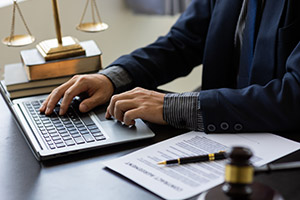 Business man typing on laptop in government