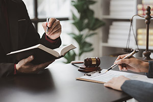 Government official at desk reading paperwork