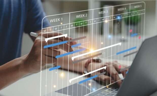 project manager working with Gantt chart schedule to update the schedule