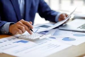 businessman working at office with documents on his desk