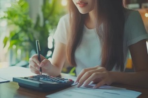 women doing accounting on desk