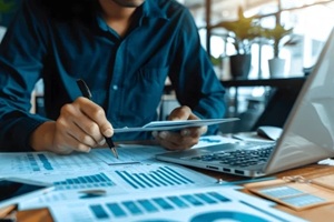 professional auditor reviewing financial statements in organized office