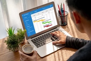 businessman using laptop for business work with coffee