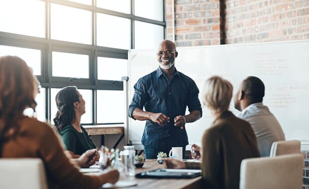 Shot of a businessman giving a presentation to his colleagues in a boardroom