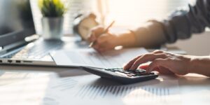 businessman calculating business balance prepare tax reduction