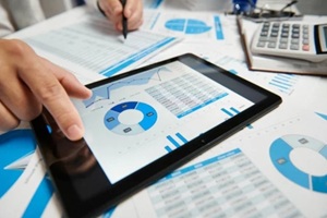 businessman working and calculating, reads and writes reports