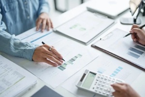 business man Auditor or internal revenue service staff checking annual financial statements company