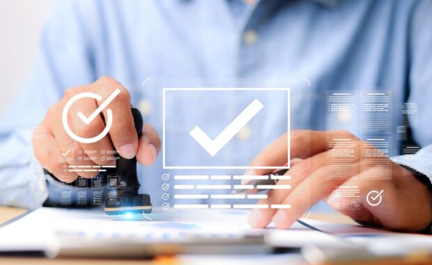 businessman stamping approved documents with digital checkmark interface