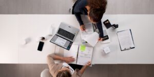 female accountant, young latina woman, auditing tax invoices