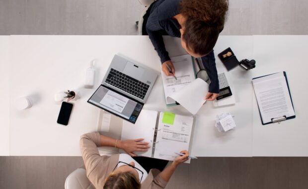 female accountant, young latina woman, auditing tax invoices