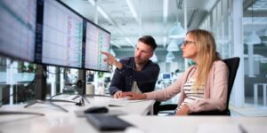 manager reviewing medical billing audit using computer