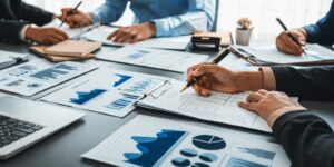 team of analyst working on financial data analysis dashboard on paper as marketing indication for business