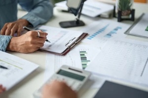 business man Auditor or internal revenue service staff checking annual financial statements company