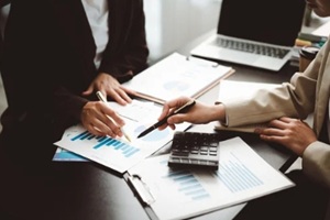 business team analyzing financial data and market statistics