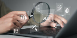 businessman using laptop computer to audit