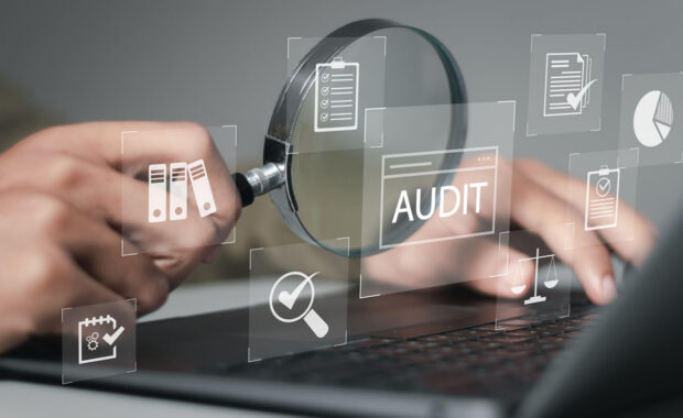 businessman using laptop computer to audit