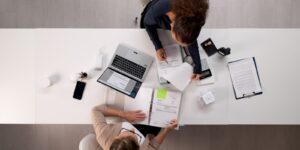 female accountant, young latina woman, auditing tax invoices