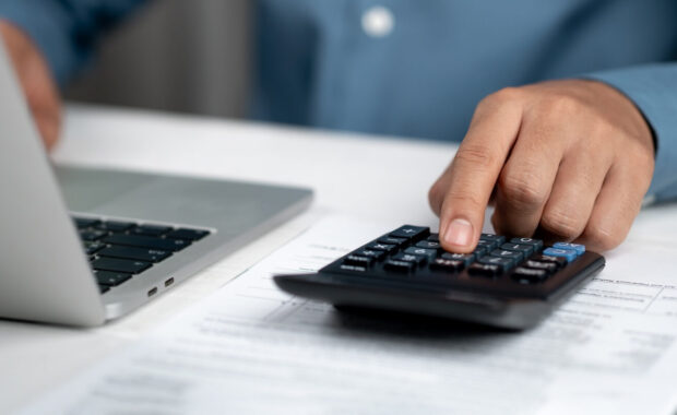 financial advisors analyze business reports and expenses at the office desk