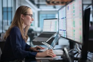 woman in office using laptop